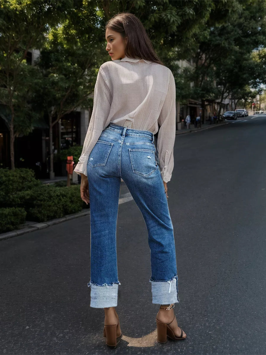 Artemis Stepped Waist Raw Hem Rolled Straight Jeans styled in the studio