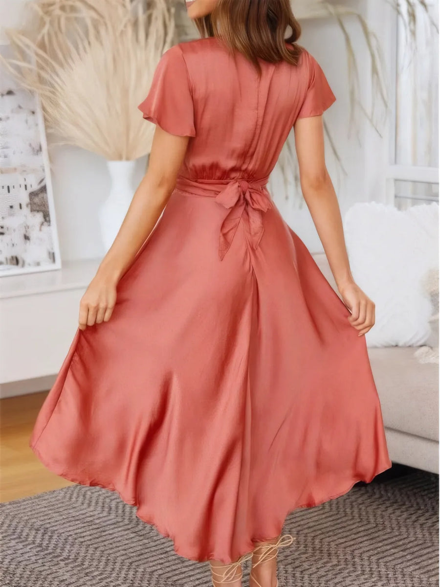 Pele High-Low Plunge Flutter Sleeve Dress styled in the studio