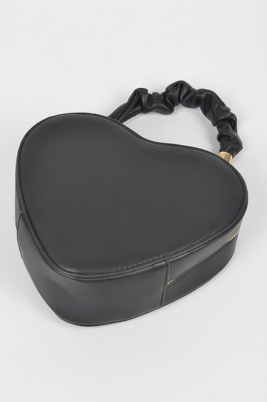Sekhmet Heart Shape Top Handle Bag styled in the studio