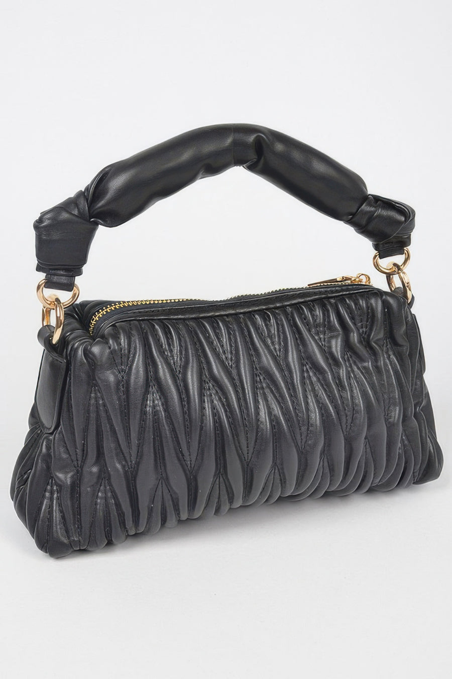 Pele Quilted Faux Leather Top Handle Bag styled in the studio